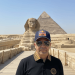 Mohamed Bourbiza standing in front of the Great Sphinx of Giza, Egypt, discussing destination marketing strategies and tourism promotion.